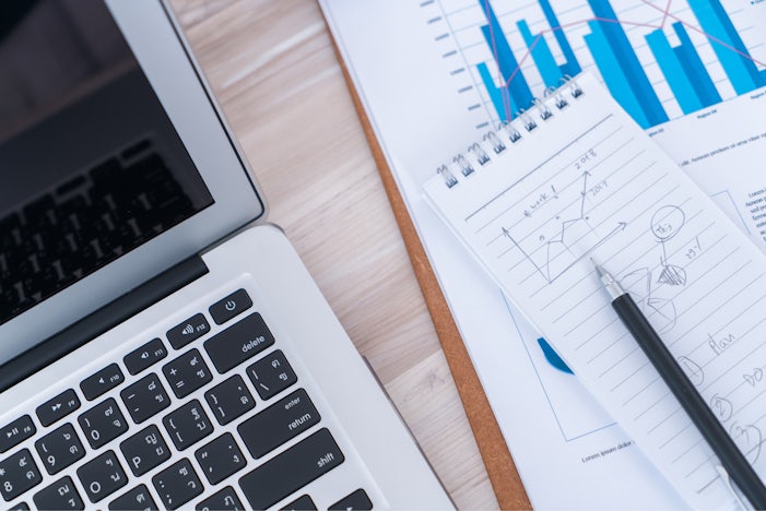 new-financial-charts-table-with-laptop